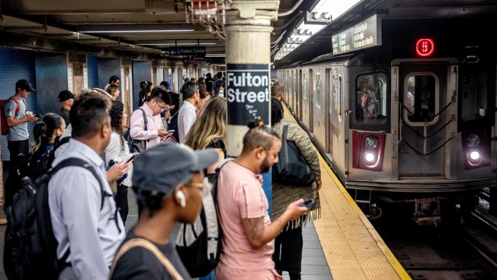 Commuters during the morning rush hour at the Fulton Center subway station in New York